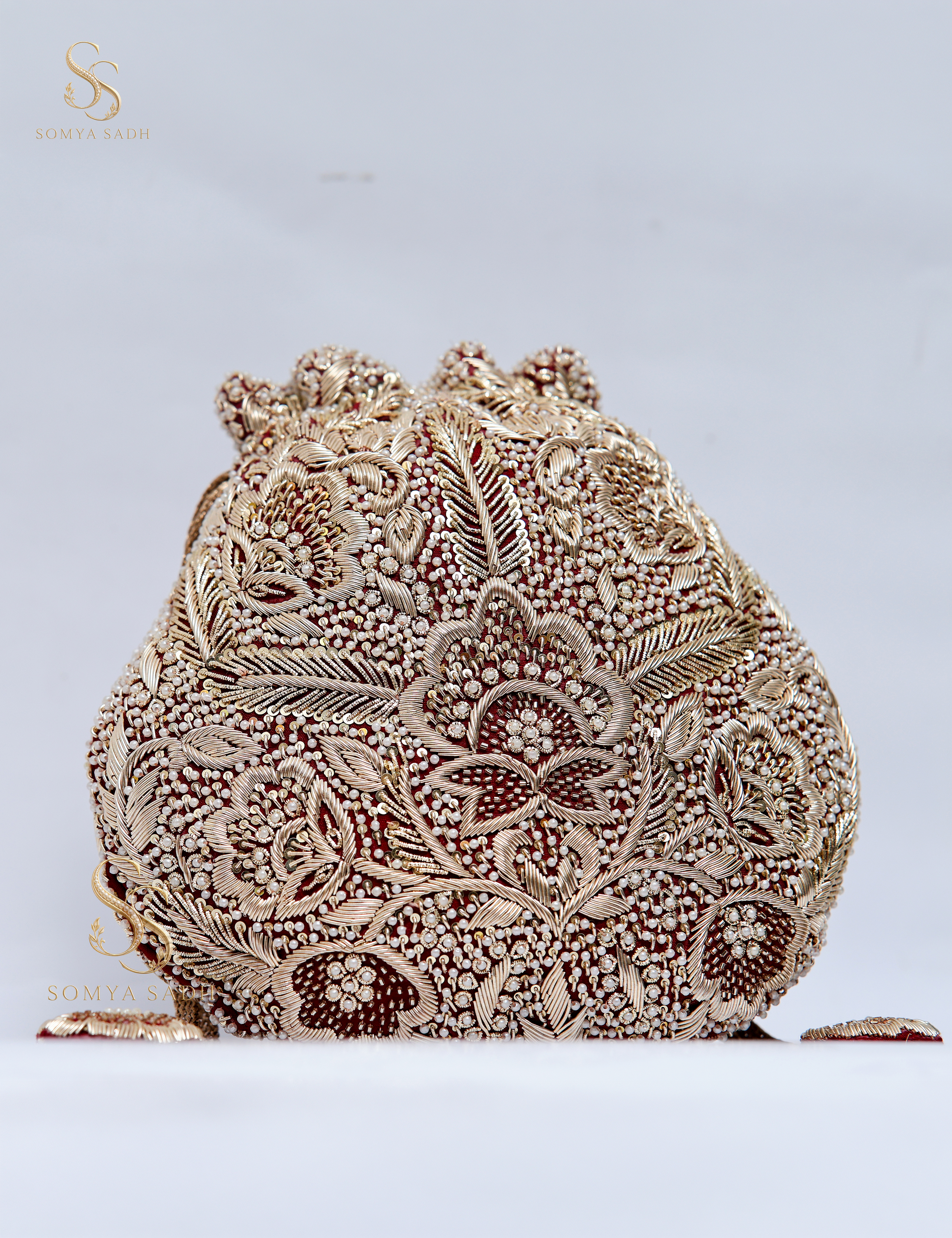Nazakat Ivory Burgundy Filigree Potli, detail or alternate product view